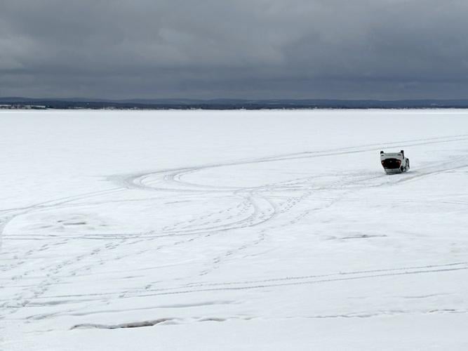 Helicopter, snowmobiles help retrieve car abandoned on sea ice 3 km from N.S. shore