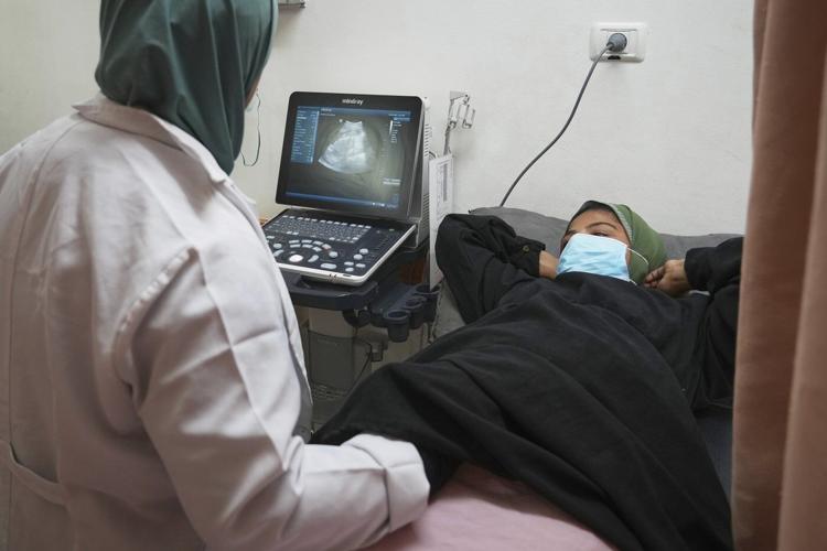 A pregnant woman under Israel's blockade in Gaza's ruins fears for her baby