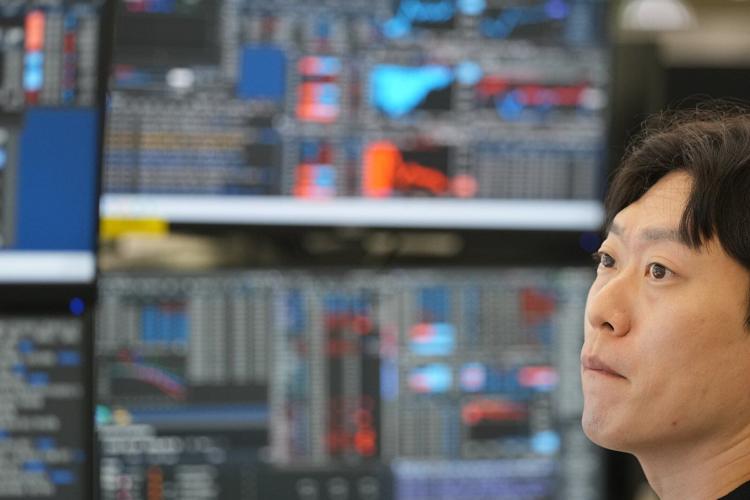 Asian markets are mixed and oil is steady after Wall Street hits records