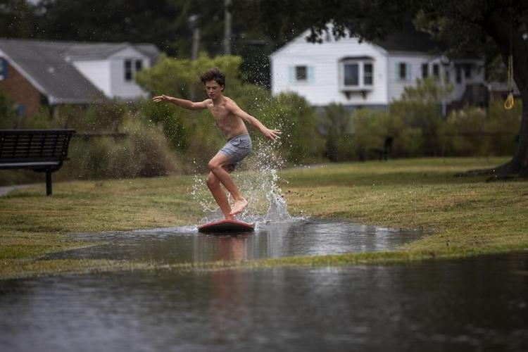 Weakening Ophelia still poses a risk of coastal flooding and heavy rain in some parts of the US