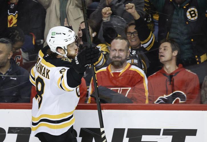 Pastrnak scores in OT as Bruins rally to beat Flames 4-3