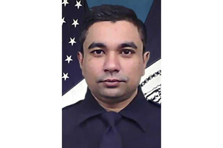 Victims of New York City shooting include a police officer and an executive at investment firm