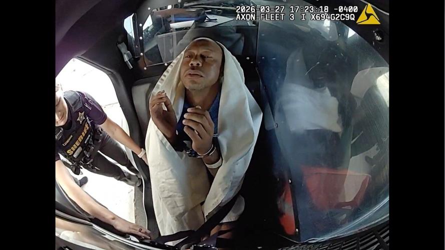 Bodycam shows a stunned Tiger Woods handcuffed after a Florida rollover crash