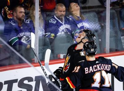 Lindholm has three-point night to lead the Flames to 5-2 win over the Canucks