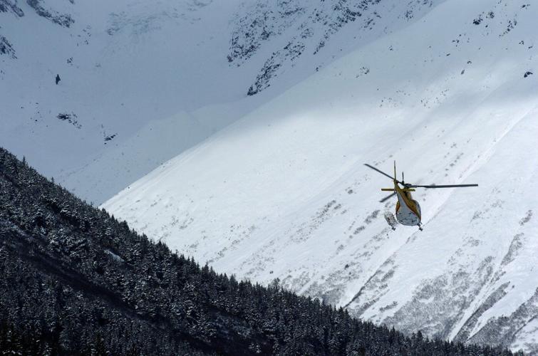 Experts and recovery teams hope to reach site of Alaska avalanche that buried 3 skiers