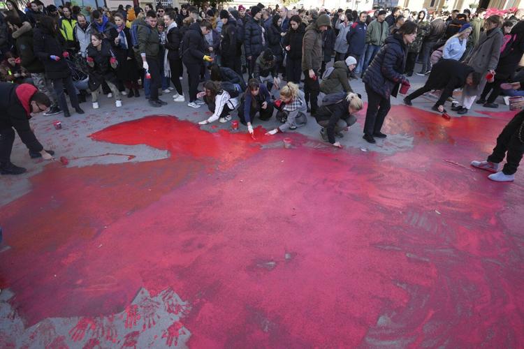 Thousands march in Serbia to mark 1 month since a roof collapse killed 15 people