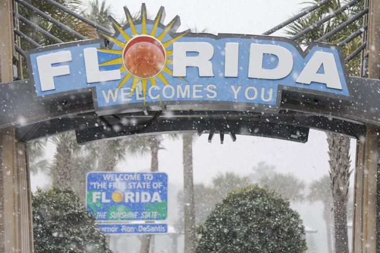 Winter storm that dropped record-breaking snow in New Orleans spreads into Florida and the Carolinas