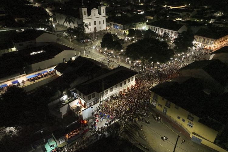 Families and revelers party side-by-side in a traditional Carnival in Sao Paulo's countryside