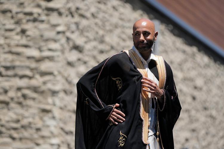 In a rainbow-trimmed robe at the World Cup, a gay Qatari doctor advocates for equal rights