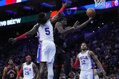Harris, Embiid carry 76ers past Raptors 104-101 in overtime