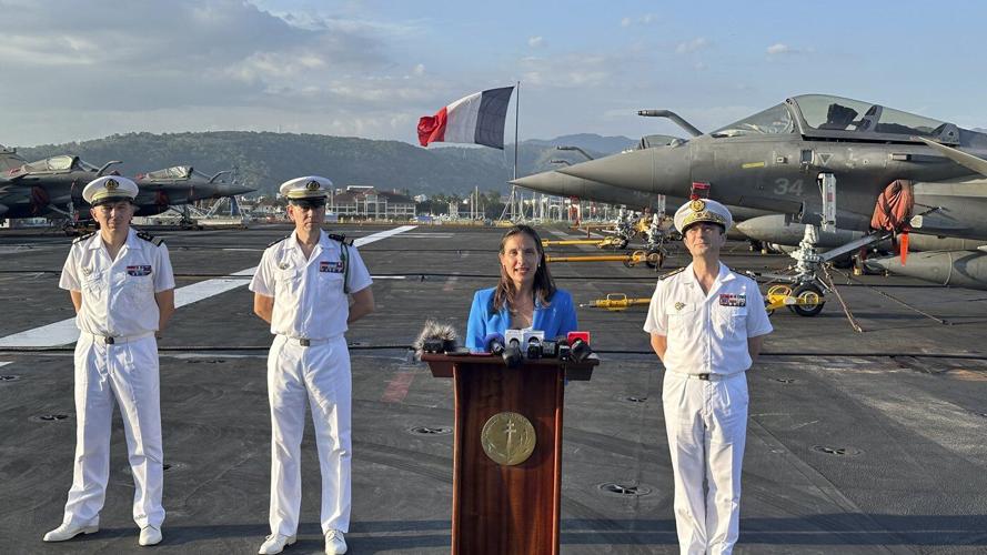 French aircraft carrier stages combat drills with Filipinos in disputed sea and visits Philippines