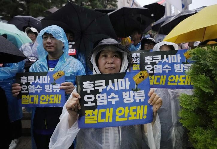 IAEA chief will visit Japan's tsunami-wrecked nuclear plant before radioactive water is released
