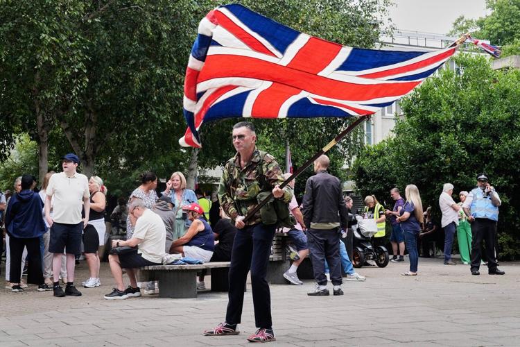 Rival anti-migrant and anti-racism protests face off outside a hotel housing migrants in London