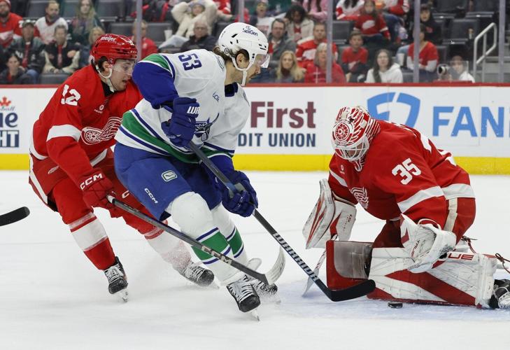 Jake DeBrusk scores hat trick, including OT game-winner, as Canucks top Red Wings 5-4