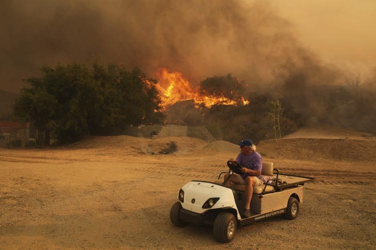 Firefighters make progress against blaze that forced thousands to flee north of Los Angeles
