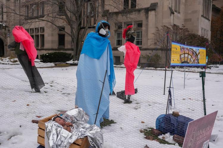 Church nativity scenes add zip ties, gas masks and ICE to protest immigration raids
