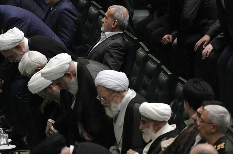 Iran’s new president is sworn in and pledges to keep trying to remove Western sanctions
