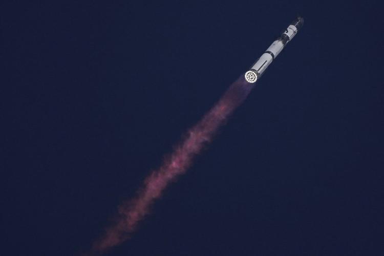 SpaceX launches giant Starship rocket, but aborts attempt to catch booster with mechanical arms