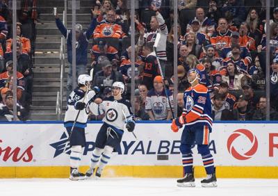 Connor's OT winner lifts Jets past Oilers, who lost McDavid late