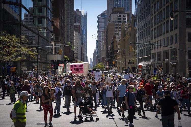 Marchers gather in worldwide protest of financial institutions "profiting off the climate crisis"