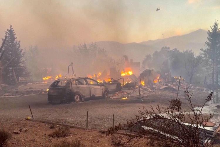 Firefighters are trying to stop a fast-moving Nevada wildfire from spreading to homes in Reno