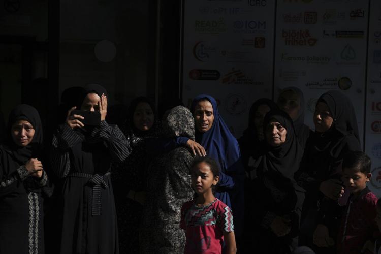 Photos show Palestinians mourning after people were killed in Israeli strikes