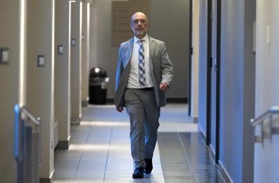 Budget officer projects considerably slower economy, declining federal deficit