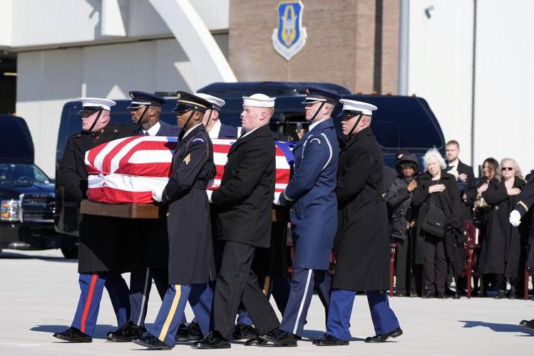Jimmy Carter's casket arrives at the US Capitol, where he will lie in state