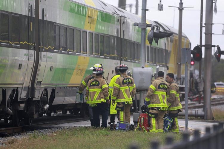 Train collides with fire truck in Florida. Police say 3 firefighters and at least 12 passengers hurt