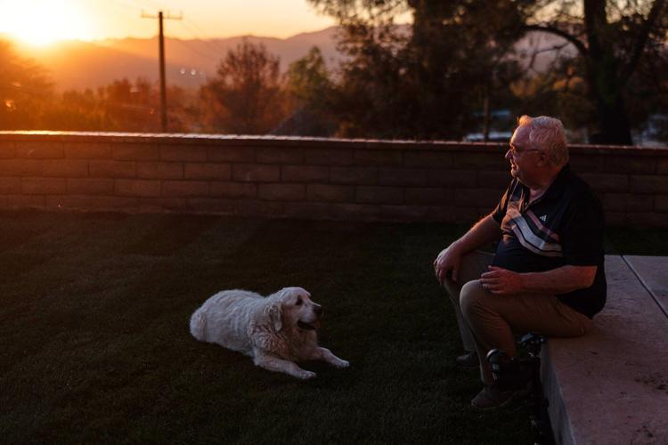 A man and his old dog are home at last after fleeing LA area fires