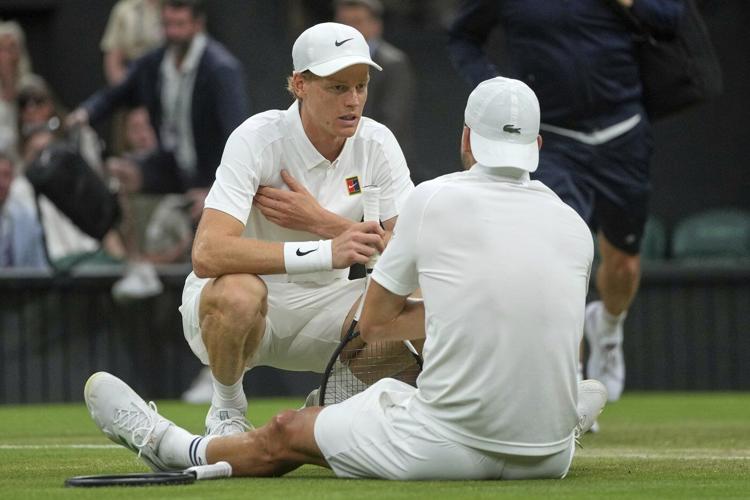 Jannik Sinner reaches Wimbledon quarterfinals despite a bad elbow when Grigor Dimitrov stops injured