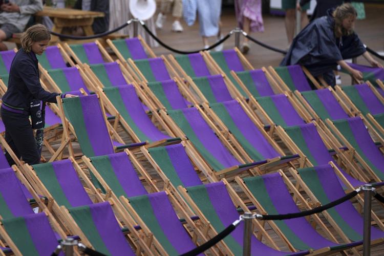 Photos show the rain on Day 3 after the Wimbledon heatwave