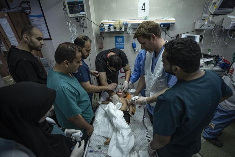 Patients and staff leave Gaza's biggest hospital, and dozens are killed at a crowded refugee camp