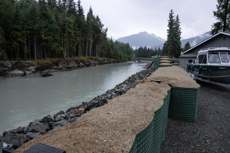 New river barriers prevented severe flood damage from a glacial outburst in Alaska, officials say