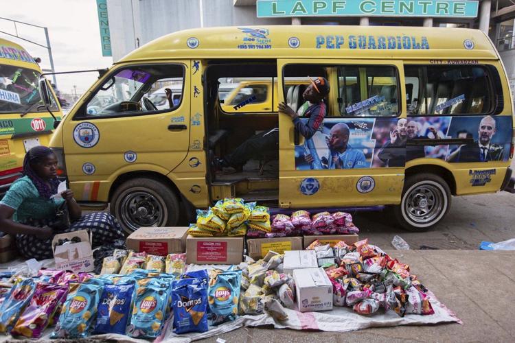 Photos of taxi drivers in Zimbabwe showing off team colors for the Premier League soccer season