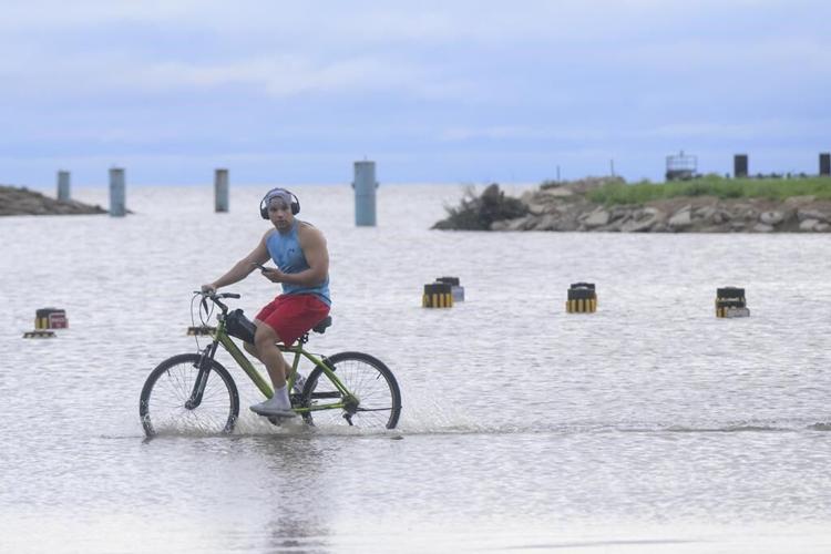 Francine weakens moving inland as the storm leaves behind flooding and widespread power outages