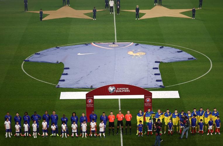 Players and fans remember victims of 2015 Paris terror attacks before France-Ukraine soccer match