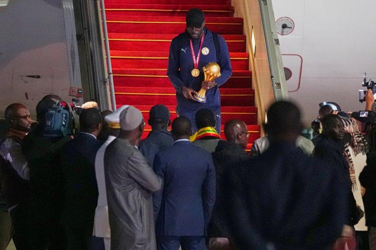 Senegal President greets team as triumphant players receive heroes welcome in Dakar