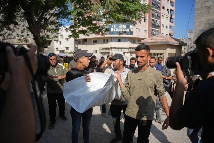 An Israeli strike hits a Gaza City apartment, killing 2 children, Palestinian health officials say