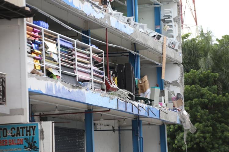 A 7.8 magnitude quake in the Philippines kills at least 32, collapses buildings and sparks tsunami