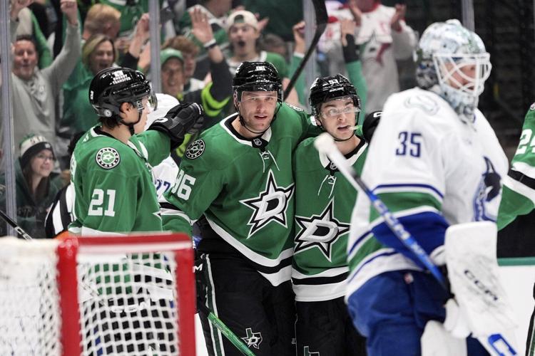 Sherwood's OT goal caps Canucks 3-goal comeback in final minute in 6-5 win over Stars