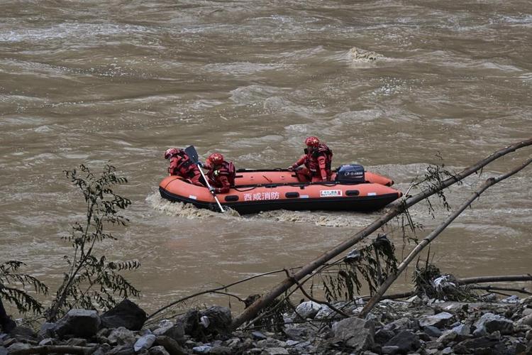 11 dead and dozens missing after a highway bridge in China crumbles in flooding and heavy storms