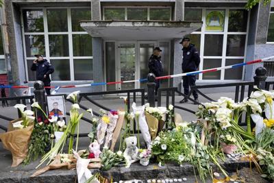 Trial opens in Serbia for parents of a teenager who fatally shot 10 people at a school last year