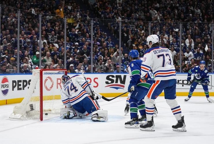 B.C.'s David Eby, Alberta's Danielle Smith watch Oilers-Canucks playoff game together