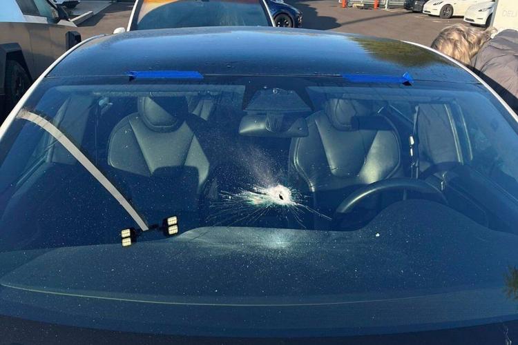 Oregon police investigate nighttime gunshots that shattered windows at Tesla dealership