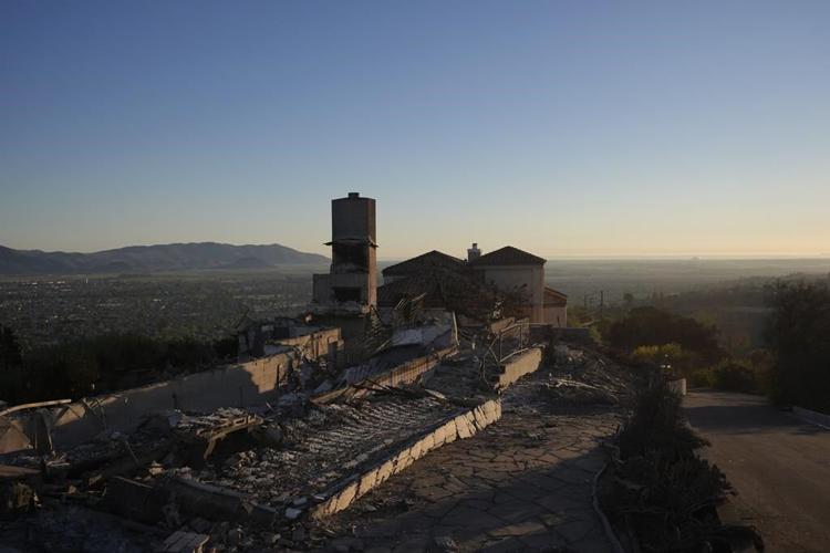 Southern California firefighters make progress against wildfire as fierce winds start to subside