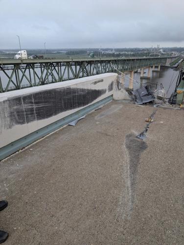 Truck smashes through barrier and plunges off a bridge into the Delaware River