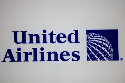Man accused of trying to open jet's door, attacking crew