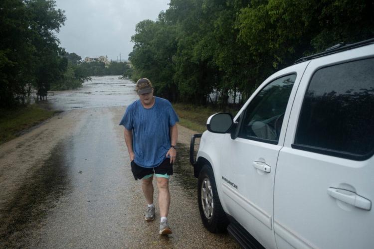 At least 1 person has died as Texas flooding forces evacuations and rescues, governor says