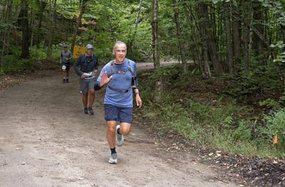 Carney surprises many with appearance at long-distance trail race